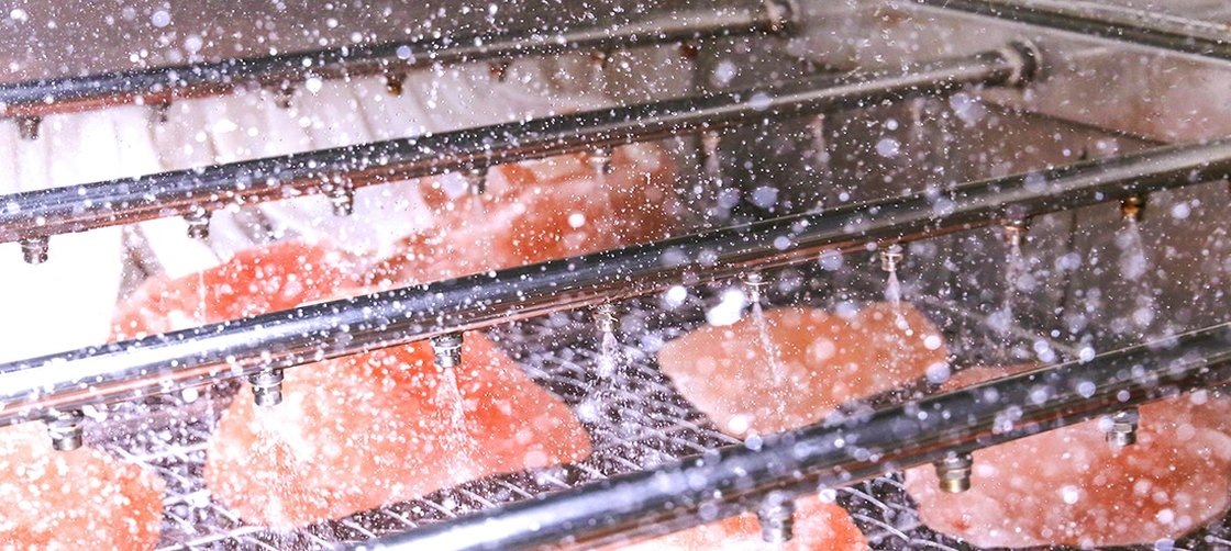 A selection of bread on a rack after being cooked